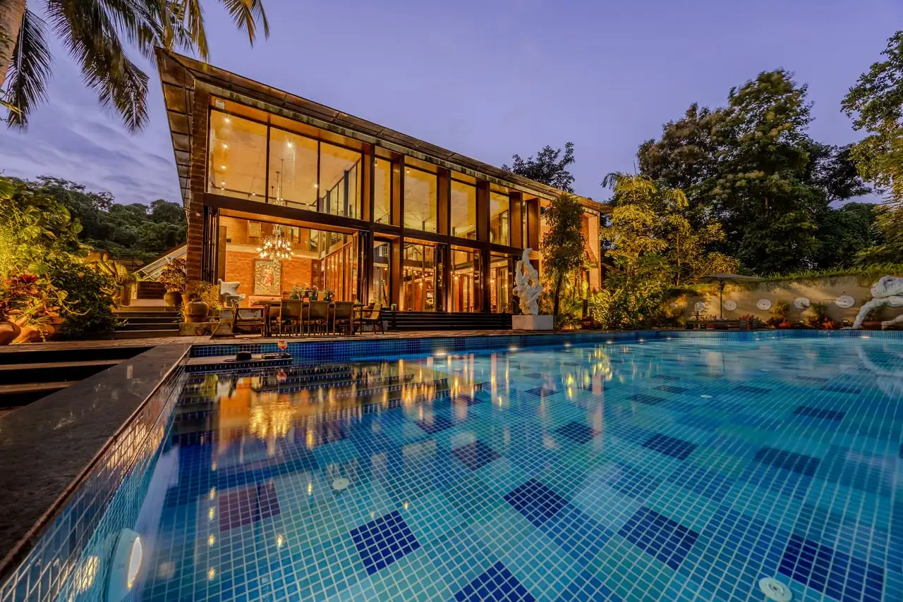 Facade and pool at dusk, El Glass Villa